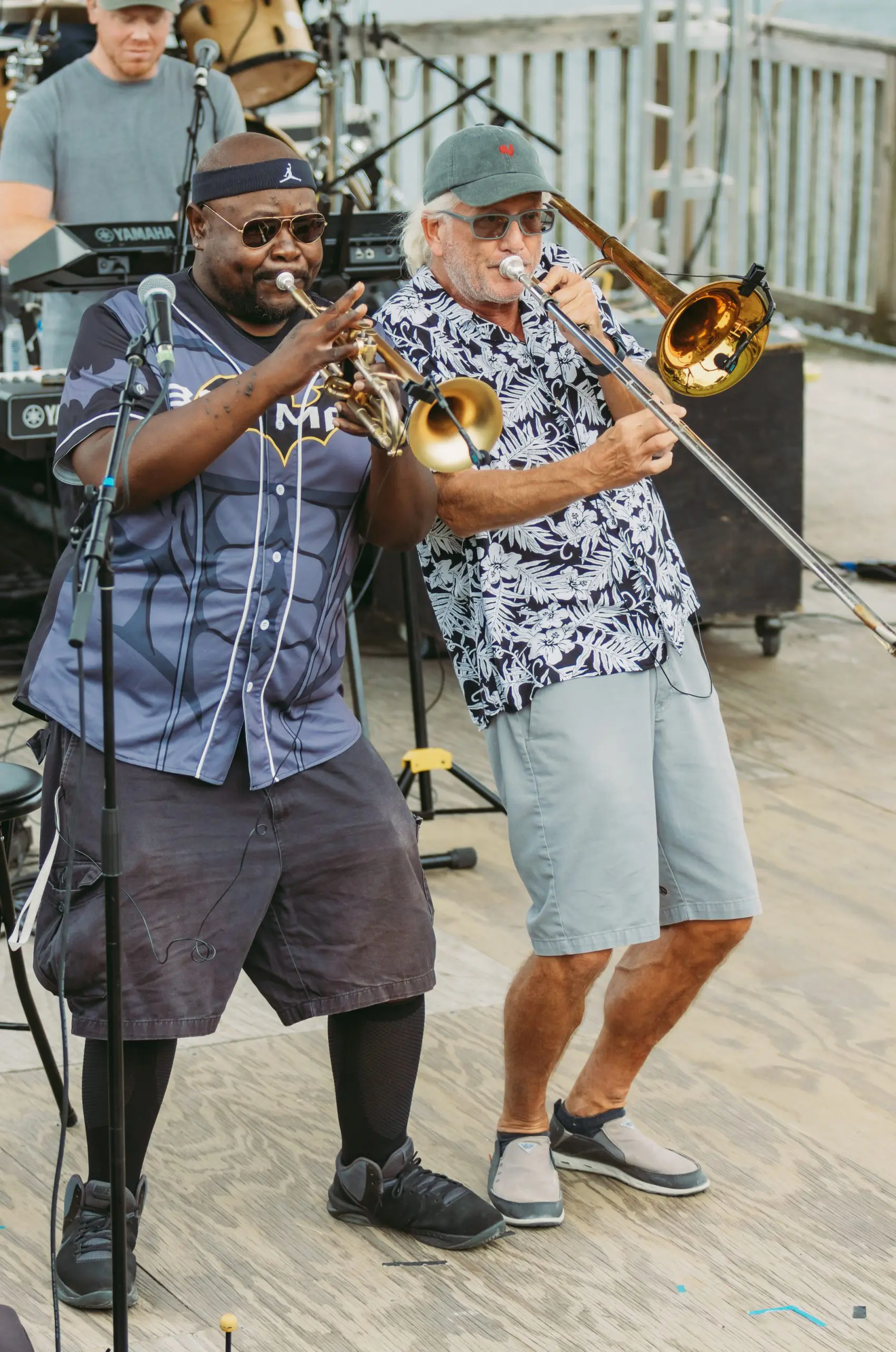 2 men playing horns